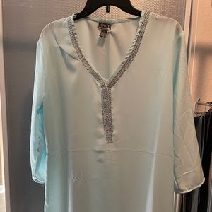 Large, light blue, half sleeve blouse.